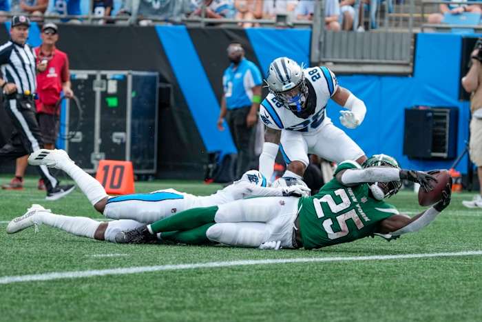 Jets' RB Israel Abanikanda reaches for the end zone on a 26-yard second-quarter run in Charlotte